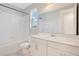 Bathroom features white cabinets, large mirror, and shower/tub combo with white tile at 11464 Beau Repost Dr, Orlando, FL 32832