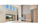 Bright living room with high ceilings, modern fireplace, and built in shelves at 11464 Beau Repost Dr, Orlando, FL 32832