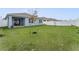 Expansive backyard featuring a well-maintained lawn, privacy fence, and ample space for outdoor activities at 1192 Sable Glen Dr, St Cloud, FL 34771