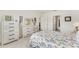 Bright bedroom featuring light wooden furniture, a comfortable bed, and natural light from the window at 1192 Sable Glen Dr, St Cloud, FL 34771