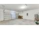 Spacious garage with concrete floor and a metal garage door at 1192 Sable Glen Dr, St Cloud, FL 34771