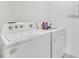 Well-lit laundry room featuring a Whirlpool washer and dryer set at 1192 Sable Glen Dr, St Cloud, FL 34771