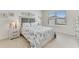 Cozy bedroom with ample natural light, neutral decor, and a comfortable queen-sized bed at 1192 Sable Glen Dr, St Cloud, FL 34771