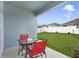 Inviting covered patio featuring a seating area perfect for outdoor relaxation and entertainment at 1192 Sable Glen Dr, St Cloud, FL 34771