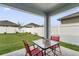 Covered patio with outdoor seating, perfect for enjoying the backyard and al fresco dining at 1192 Sable Glen Dr, St Cloud, FL 34771