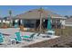 Community clubhouse, pool and seating area, with well-maintained landscaping at 1192 Sable Glen Dr, St Cloud, FL 34771