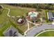 Overhead view of the community amenities including a pool, playground, and walking path at 12191 Sumter Dr, Orlando, FL 32824