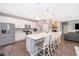 Modern kitchen featuring stainless steel appliances, a large island, and stylish white cabinetry at 12191 Sumter Dr, Orlando, FL 32824