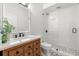Modern bathroom with white subway tile, glass shower, and wood vanity with white countertop at 1404 Kelso Blvd, Windermere, FL 34786