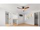 Bright bedroom with wood floors, ceiling fan, and multiple closet spaces at 1404 Kelso Blvd, Windermere, FL 34786