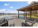 Private dock and lake view from the waterfront home featuring a seating area at 1404 Kelso Blvd, Windermere, FL 34786