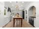 Spacious kitchen with white cabinets, stainless steel appliances, and large center island at 1404 Kelso Blvd, Windermere, FL 34786