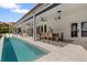 Inviting pool and outdoor dining area perfect for entertaining with lake views at 1404 Kelso Blvd, Windermere, FL 34786