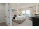 Spacious bedroom features a plush bed, contemporary furniture, lots of natural light and carpeted floors at 15295 Rising View Dr, Montverde, FL 34756