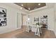 Additional perspective of the home office with stylish shelving and decor at 15295 Rising View Dr, Montverde, FL 34756