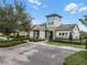 Charming clubhouse exterior with stone accents, well-maintained landscaping, and accessible parking at 16027 Juniper Inlet Aly, Winter Garden, FL 34787