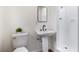 Bathroom showcasing a modern vanity with a sleek faucet and a tiled walk-in shower at 1607 31St Nw St, Winter Haven, FL 33881