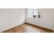 Bedroom with wood-look floors, and a window providing natural light at 1607 31St Nw St, Winter Haven, FL 33881