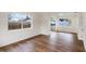 Spacious bedroom featuring wood-look floors and large windows for ample natural light at 1607 31St Nw St, Winter Haven, FL 33881