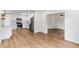Eat-in kitchen featuring stainless steel appliances, white cabinets, and views of the open floorplan at 1607 31St Nw St, Winter Haven, FL 33881