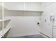 Clean, white pantry featuring built-in shelving for ample storage space at 1607 31St Nw St, Winter Haven, FL 33881