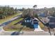 Aerial view of a single-story home with mature landscaping and a paved driveway at 16224 Sw 55Th Court Rd, Ocala, FL 34473