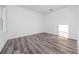 Bedroom featuring hardwood floors and white trim at 16224 Sw 55Th Court Rd, Ocala, FL 34473