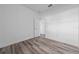 Bright bedroom with hardwood floors, white walls, and open door at 16224 Sw 55Th Court Rd, Ocala, FL 34473