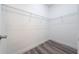 Walk-in closet with wire shelving and wood floor at 16224 Sw 55Th Court Rd, Ocala, FL 34473