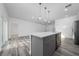 Modern kitchen with stainless steel appliances, gray cabinets and island at 16224 Sw 55Th Court Rd, Ocala, FL 34473