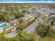 Aerial view of the community near retail space showcasing community pool and clubhouse at 163 Springwood Cir # D, Longwood, FL 32750