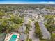 An aerial view of the community showcasing its swimming pool, tennis courts and convenient proximity to local shopping centers at 163 Springwood Cir # D, Longwood, FL 32750