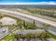 Aerial view shows the community building's proximity to the highway at 163 Springwood Cir # D, Longwood, FL 32750