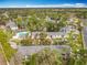 Aerial view shows the community amenities, swimming pool, tennis courts, and manicured landscaping at 163 Springwood Cir # D, Longwood, FL 32750