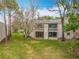 Rear exterior view showcases the upper and lower balconies of the residential units at 163 Springwood Cir # D, Longwood, FL 32750