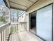 Balcony with wood decking provides access to the interior through sliding glass doors at 163 Springwood Cir # D, Longwood, FL 32750