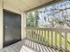 Balcony with wood decking features a storage closet and views of the community green space at 163 Springwood Cir # D, Longwood, FL 32750
