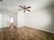 This bedroom features hardwood floors and an ensuite bathroom with a toilet and sink at 163 Springwood Cir # D, Longwood, FL 32750