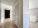 Tiled hallway with storage cabinets and view to the kitchen area at 163 Springwood Cir # D, Longwood, FL 32750
