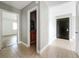 Bright tiled hallway leading to bedroom and bathroom area at 163 Springwood Cir # D, Longwood, FL 32750