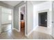 Bright tiled hallway leading to bedroom and bathroom area at 163 Springwood Cir # D, Longwood, FL 32750