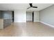Open living space showcasing tile floors with breakfast bar and kitchen access at 163 Springwood Cir # D, Longwood, FL 32750