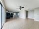 Open living space featuring tile flooring and seamless flow into updated kitchen at 163 Springwood Cir # D, Longwood, FL 32750
