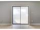 Sliding glass doors with privacy film, providing access to outdoor balcony at 163 Springwood Cir # D, Longwood, FL 32750