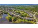 Lush aerial showcasing a golf course neighborhood, serene lakes, and charming residences at 1714 Golfview Dr, Kissimmee, FL 34746