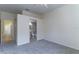Spacious bedroom with neutral carpet, ensuite bathroom, and a bright window at 1714 Golfview Dr, Kissimmee, FL 34746