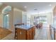Kitchen with island seating that flows into a casual dining area by the large picture window at 1714 Golfview Dr, Kissimmee, FL 34746