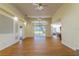 A spacious living room features hardwood floors and high ceilings for comfortable living at 1714 Golfview Dr, Kissimmee, FL 34746