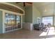 Relaxing enclosed patio with tiled floor, bench seating, and serving area with nature view at 1714 Golfview Dr, Kissimmee, FL 34746