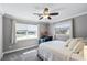 Bedroom features natural light, two windows and neutral tones for a calm and inviting space at 2003 Woodcrest Dr, Winter Park, FL 32792